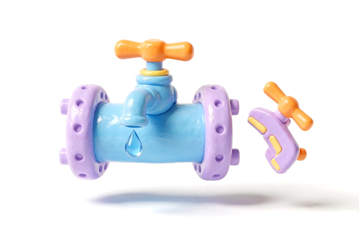 A pipe with a tap and a drop of water beside a spare valve
