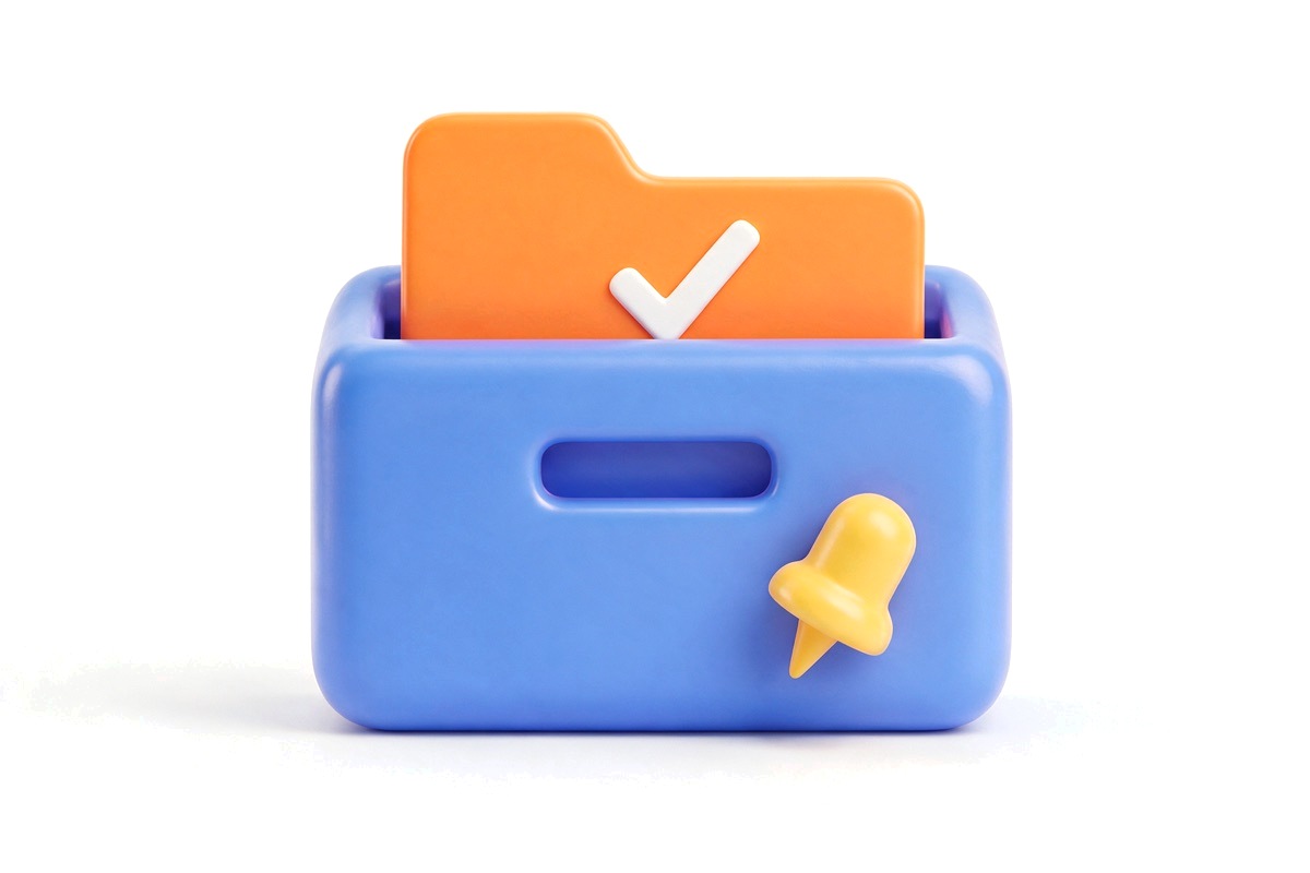 Blue card index box with one orange card pulled out showing a tick