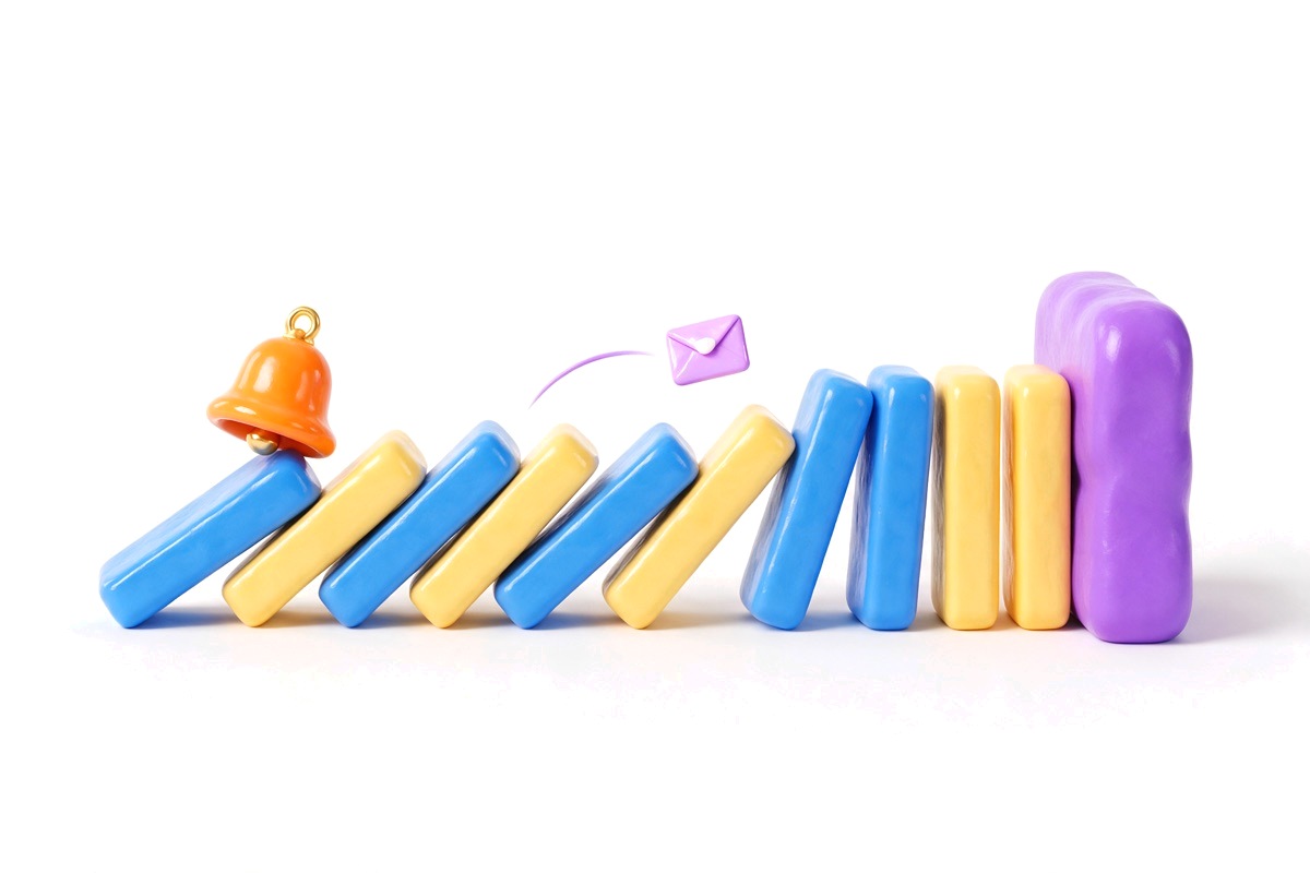 Row of dominoes stopped by a purple block with a bell and an envelope