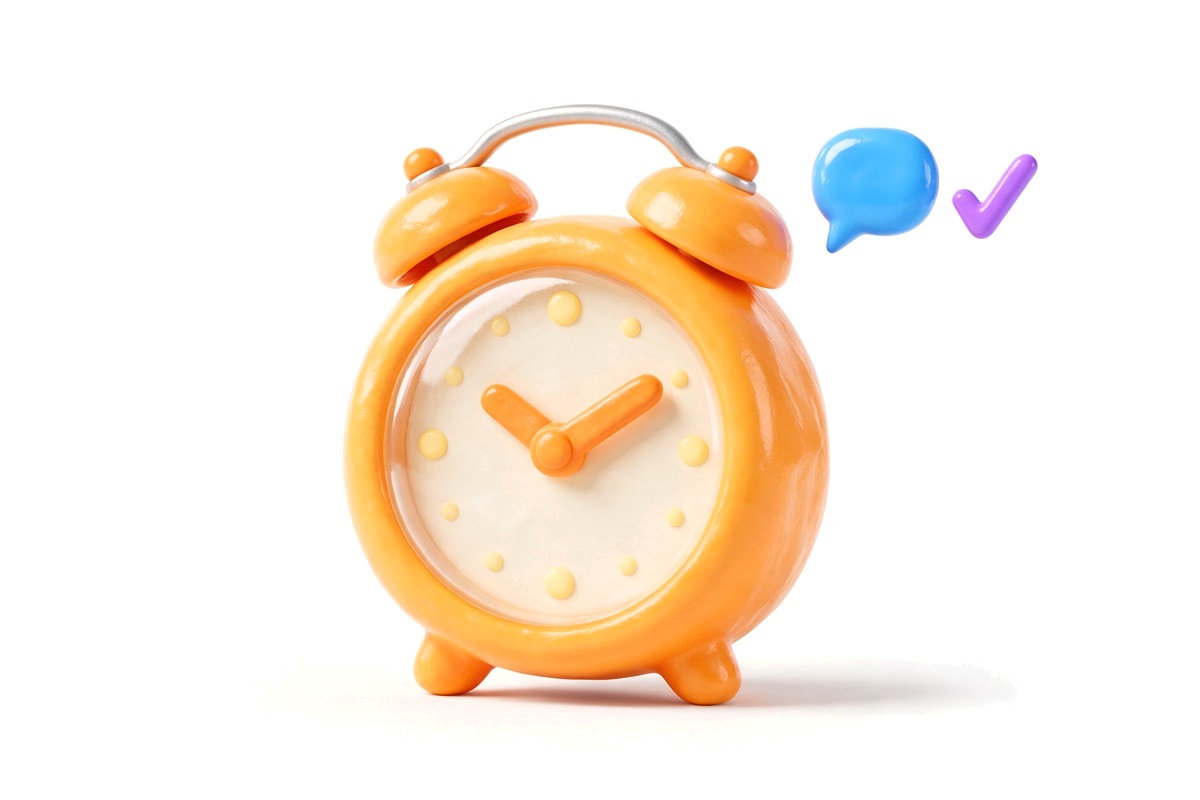 Orange alarm clock with a blue speech bubble and a purple tick
