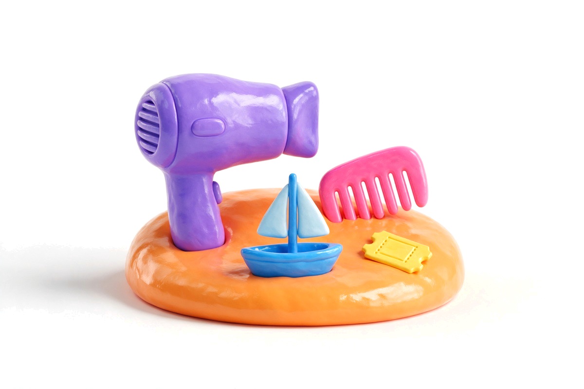 Purple hairdryer, pink comb, blue sailboat and yellow ticket on orange base