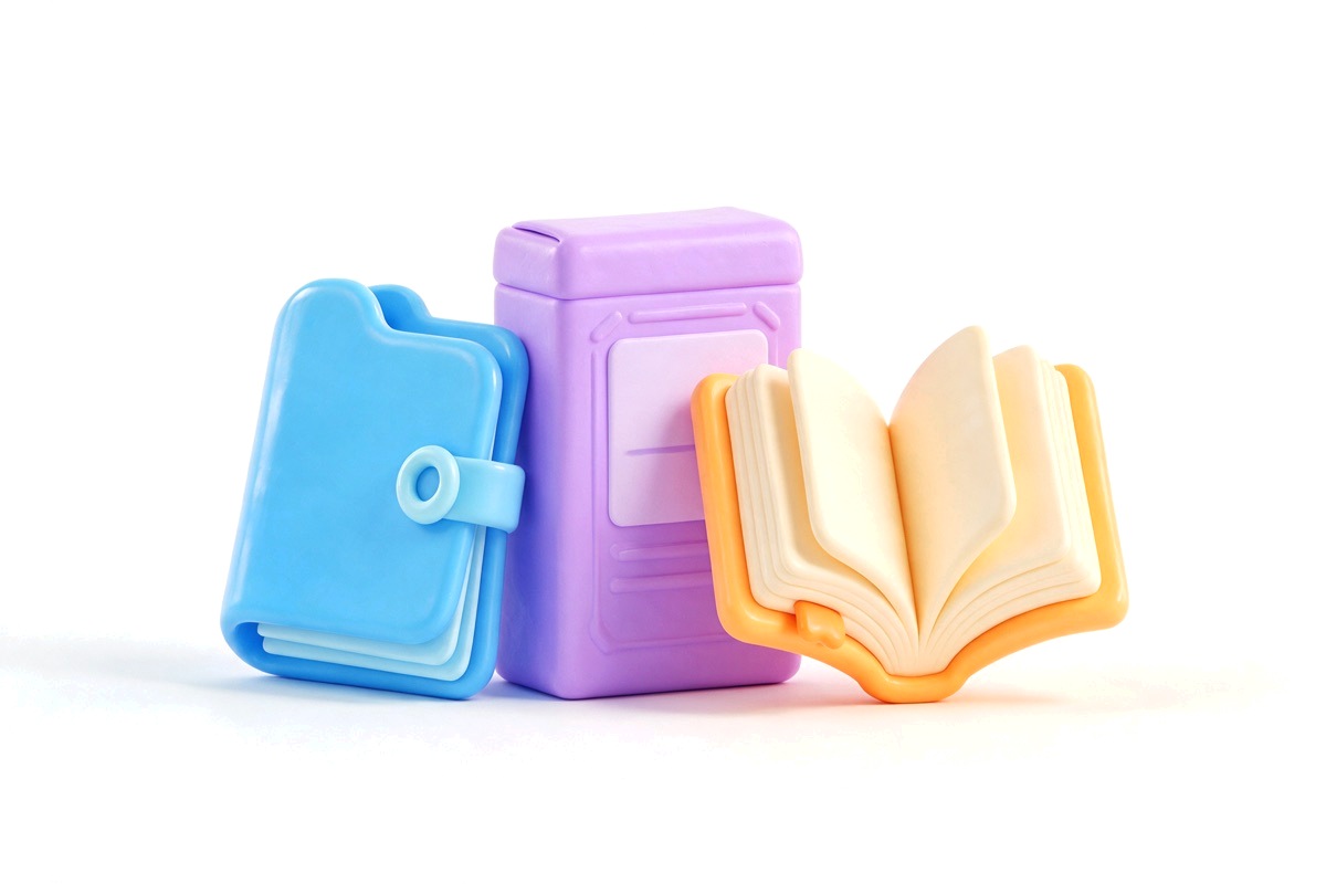 Folder, product box and open book standing side by side