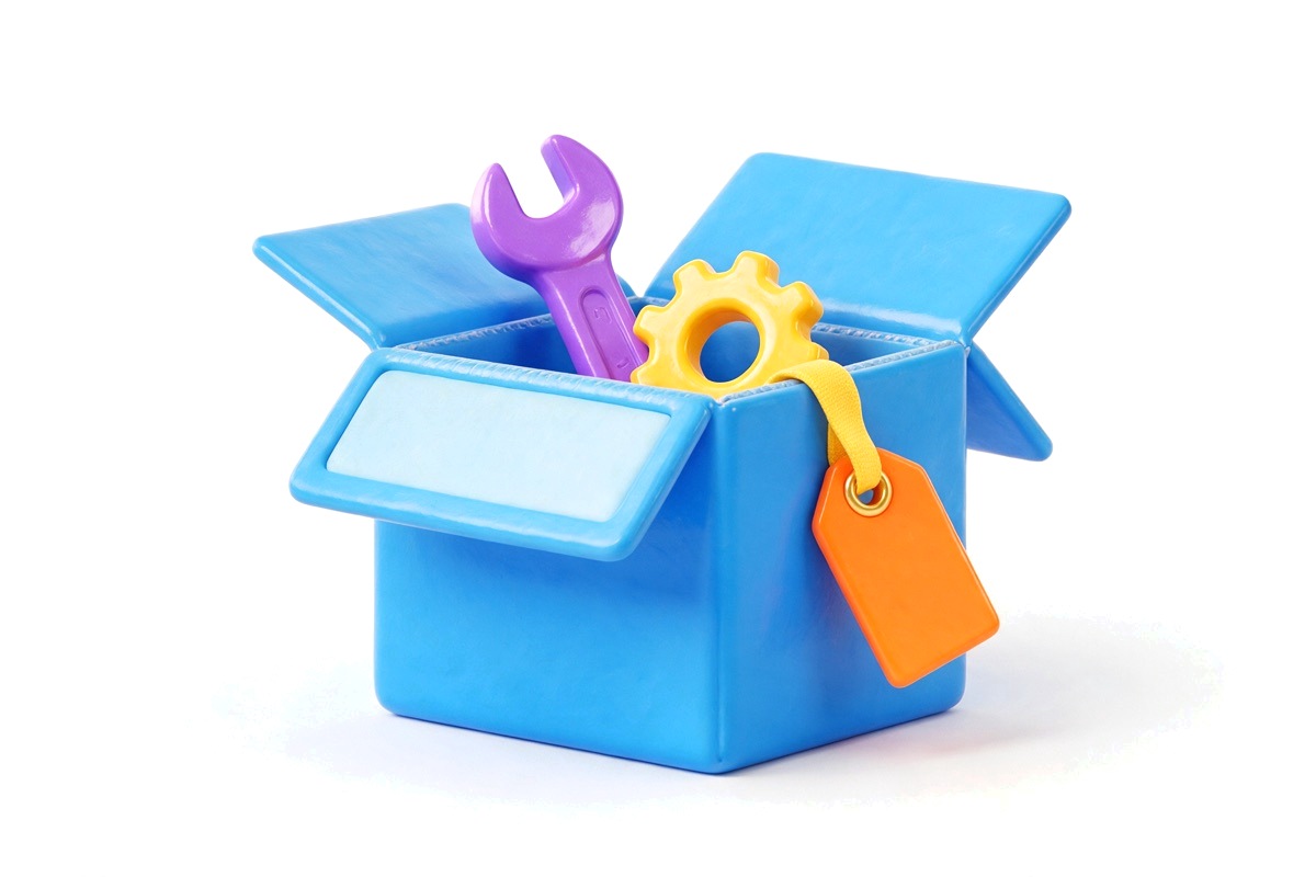 Blank blue cardboard box holding a purple wrench and yellow gear with an orange tag