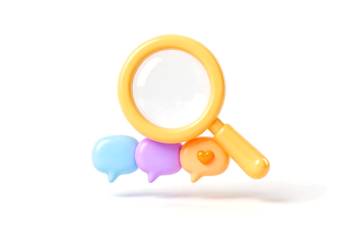 Yellow magnifying glass over three speech bubbles, the last holding a heart