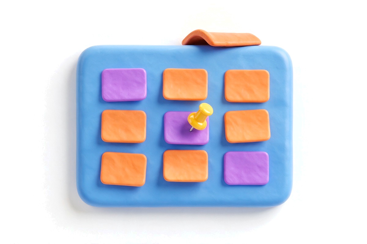 Blue board with three columns of purple and orange cards and a roof tile on top