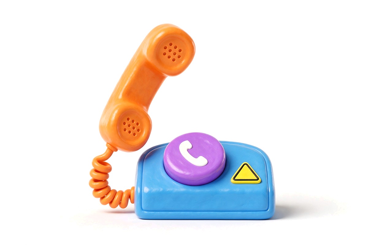 Orange telephone handset on a blue base with a purple button and hazard triangle